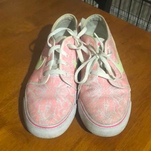 White pink and neon green Nike shoes